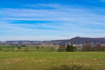Fototapeta premium View over the fields to a village in Germany