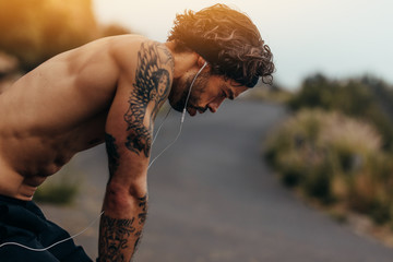 Athlete taking rest after a run - Powered by Adobe