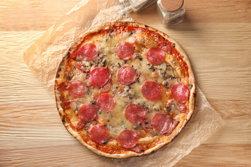 Tasty pepperoni pizza on wooden table