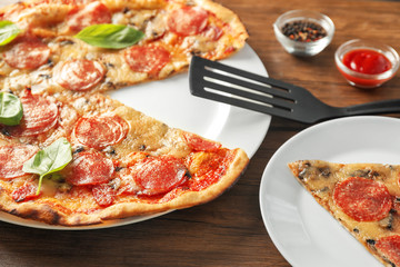 Tasty pepperoni pizza on wooden table