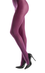 Legs of beautiful young woman in tights on white background