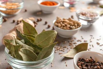 Bowl with bay leaves on table