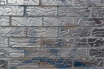 Old brick wall painted metallic silver