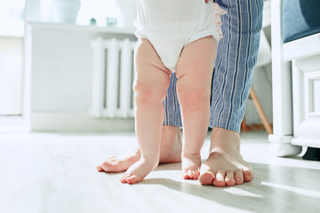 father and his baby daughter at home