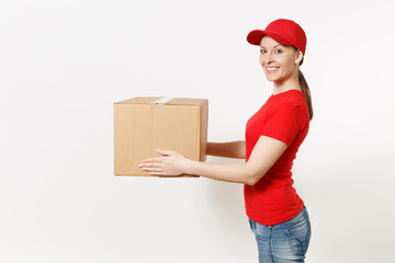 Delivery woman in red uniform isolated on white background. Female in cap, t-shirt, jeans working as courier or dealer holding cardboard box. Receiving package. Copy space for advertisement. Side view