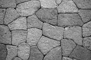 Texture of old rock wall for background. Black and white