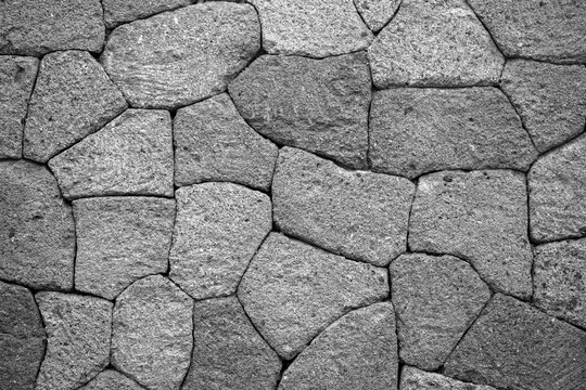 Texture of old rock wall for background. Black and white © OlegD