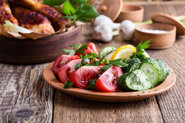 Chicken drumsticks and fresh vegetables, favorite meal