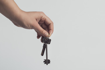 keys in hand isolated on white background, toned image