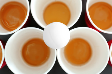 Cups and ball for beer pong, closeup