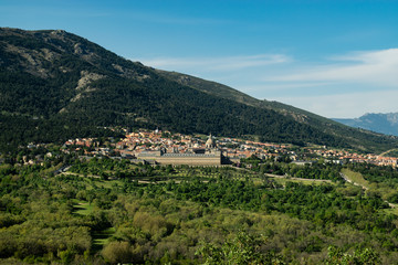 Fototapeta na wymiar View towards the Royal Monastery of San Lorenzo del Escorial. Photograph taken from the Chair of Felipe II in the municipality of El Escorial in Madrid (Spain)