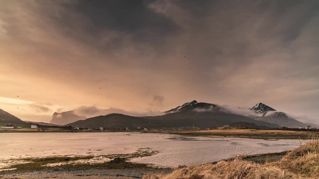 A scenic and low angle time lapse of a sunset and clouds at the Lofoten Islands / Norway 