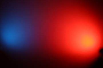 Red and blue ray of light on a black background