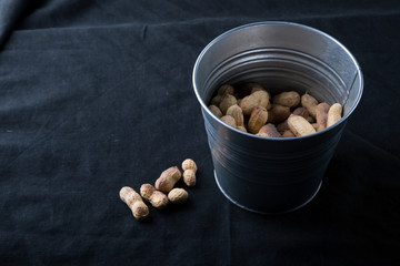 Peanuts in a metal bucket