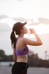 Fitness woman drinking water. Fitness and healthy lifestyle concept.