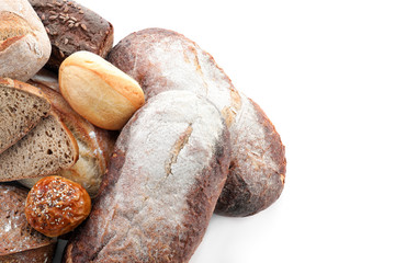 Variety of fresh tasty bread on white background