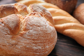 Fresh tasty bread on table, closeup