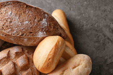 Variety of fresh tasty bread on table