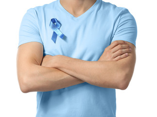 Man with symbolic blue ribbon on white background. Prostate cancer concept