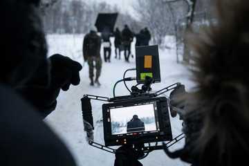 Shooting a feature film, backstage on the set in the street in the winter, the view from the...