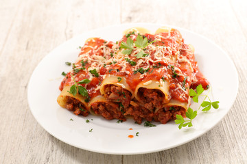 canneloni with beef and tomato sauce