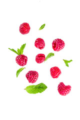 Creative layout, background, with fresh berries, simple pattern on white background. Raspberry, blueberry, mint leaves, slices of lemon.