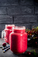 Summer fruity vitamin drink. homemade cherry smoothie on dark background