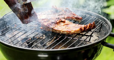 preparing american bbq ribs on grill