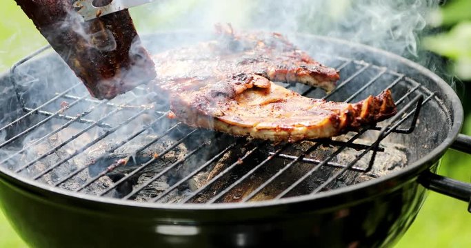 preparing american bbq ribs on grill