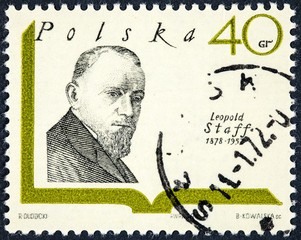 A stamp printed in Poland  shows a portrait image of polish writer Leopold Staff