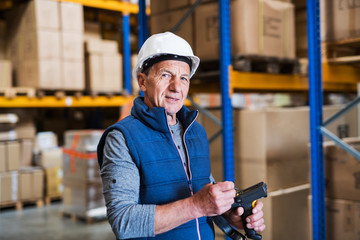Portrait of a senior male warehouse worker or a supervisor.