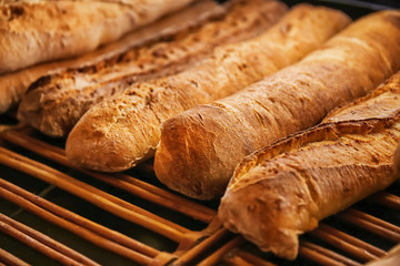 Tasty bread on shelf in bakery