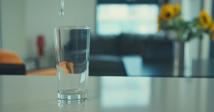 Sparkling water being poured in slow motion