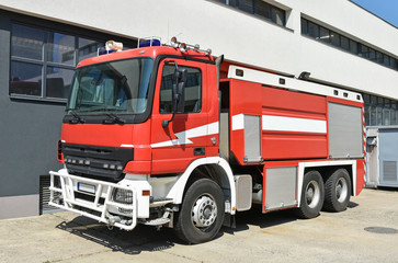Firefighter vehicle next to the fire station