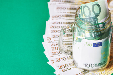 Banknotes euro in glass jar