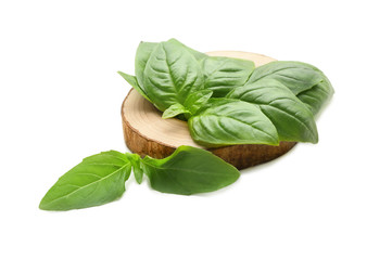Wooden stand with fresh basil on white background