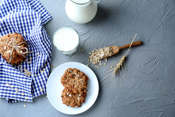 Composition with delicious oatmeal cookies on grey background
