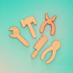 Top view of wooden boy tools toys.