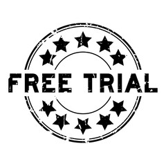 Grunge black free trial word with star icon round rubber seal stamp on white background