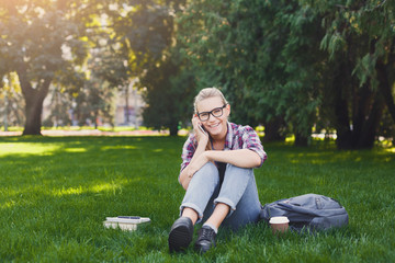 Happy woman talking on phone and smiling outdoors