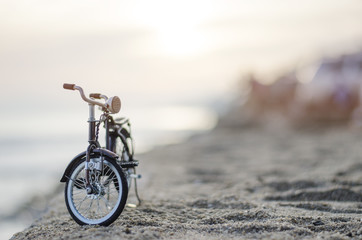 bicycle toy on beach sunset time holiday