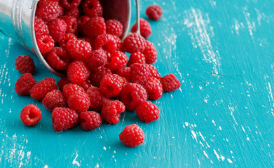 Fresh raspberries in a bucket