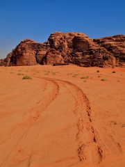 Fototapeta na wymiar Wadi Rum - Road tracks in the desert