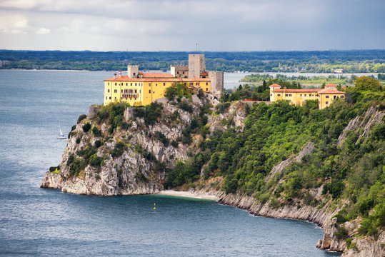 View of Duino castle from the Rilke trail, a tourist trail, providing a scenic view of Trieste gulf. Friuli Venezia Giulia, Italy.