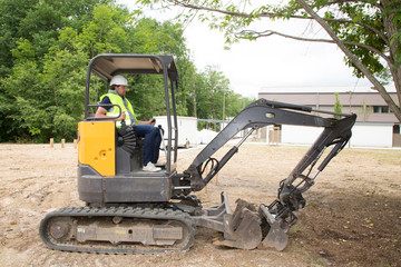 Picture of working excavator driver man in summer day
