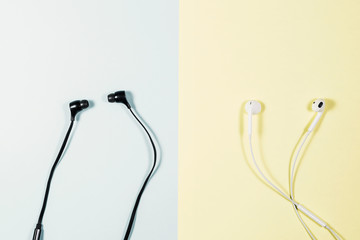 Black and white earphone on the paper soft tone color.