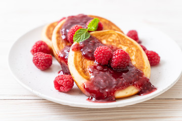 pancake with fresh raspberries and raspberry sauce