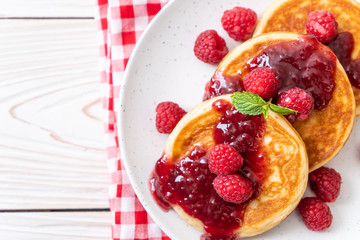 pancake with fresh raspberries and raspberry sauce