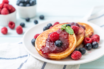 pancake with fresh raspberries and blueberries