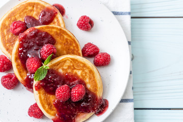 pancake with fresh raspberries and raspberry sauce